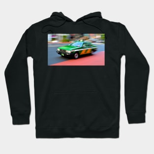 shinjuku taxi zooms by Hoodie